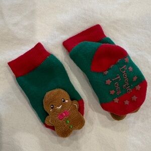 Festive Red and Green Baby Socks with Gingerbread Design and rattle on toes